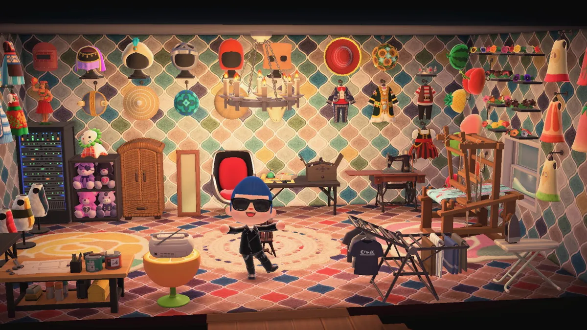 Slothra stands in a large room with dresses, hats, masks, and headbands across all the walls. There is a loom and sewing machine to the left, along with a drying rack and an ironing board, and to the right there are more dresses, a DIY table, a wardrobe, a mirror, and a server.