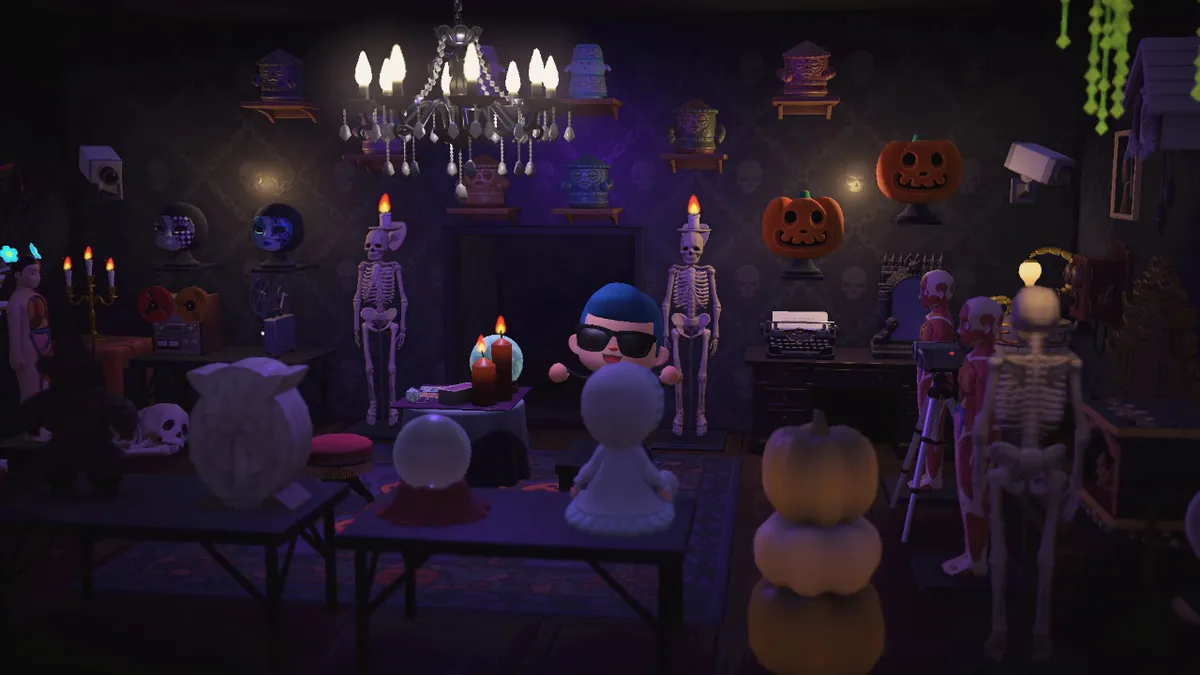 Slothra is now on the other side of the room, where there are skeletons, masks, tape recorders, and a collection of gyroids on the wall