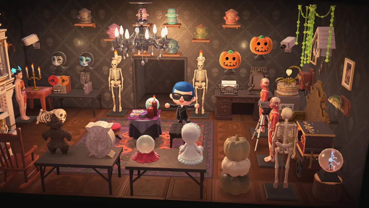 Slothra is on the other side of the Seance Room with the lights on, where you can see the Boomoids more clearly on the wall. There is also a reel-to-reel tape recorder, a film projector, a typewriter, and plenty of skeletons and anatomical figures, as well as CCTV cameras on the wall.