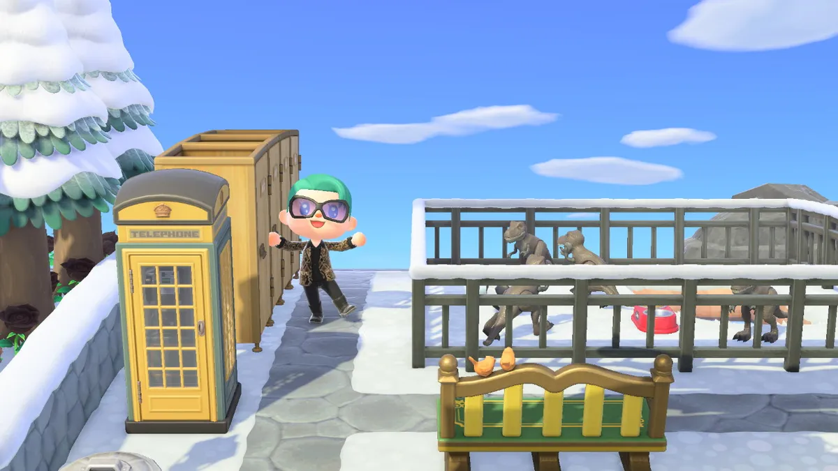 Slothra is standing next to a fenced-off area, which contains little tyrannosaurus rex dinosaurs. To the left, there's a row of toilet stalls and a phone box.