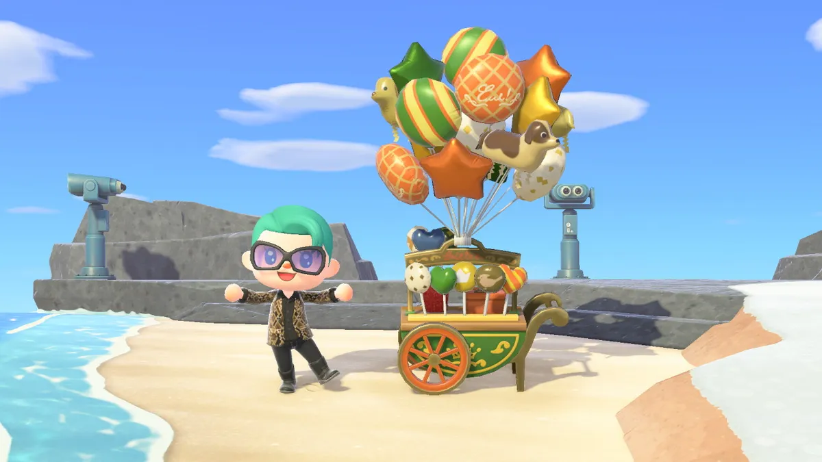 Slothra is standing next to a balloon stand, with plenty of balloons for sale.