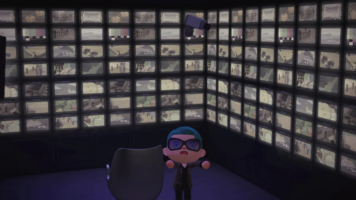 Slothra stands in a room covered in CCTV television screens. There is a single chair in the middle.