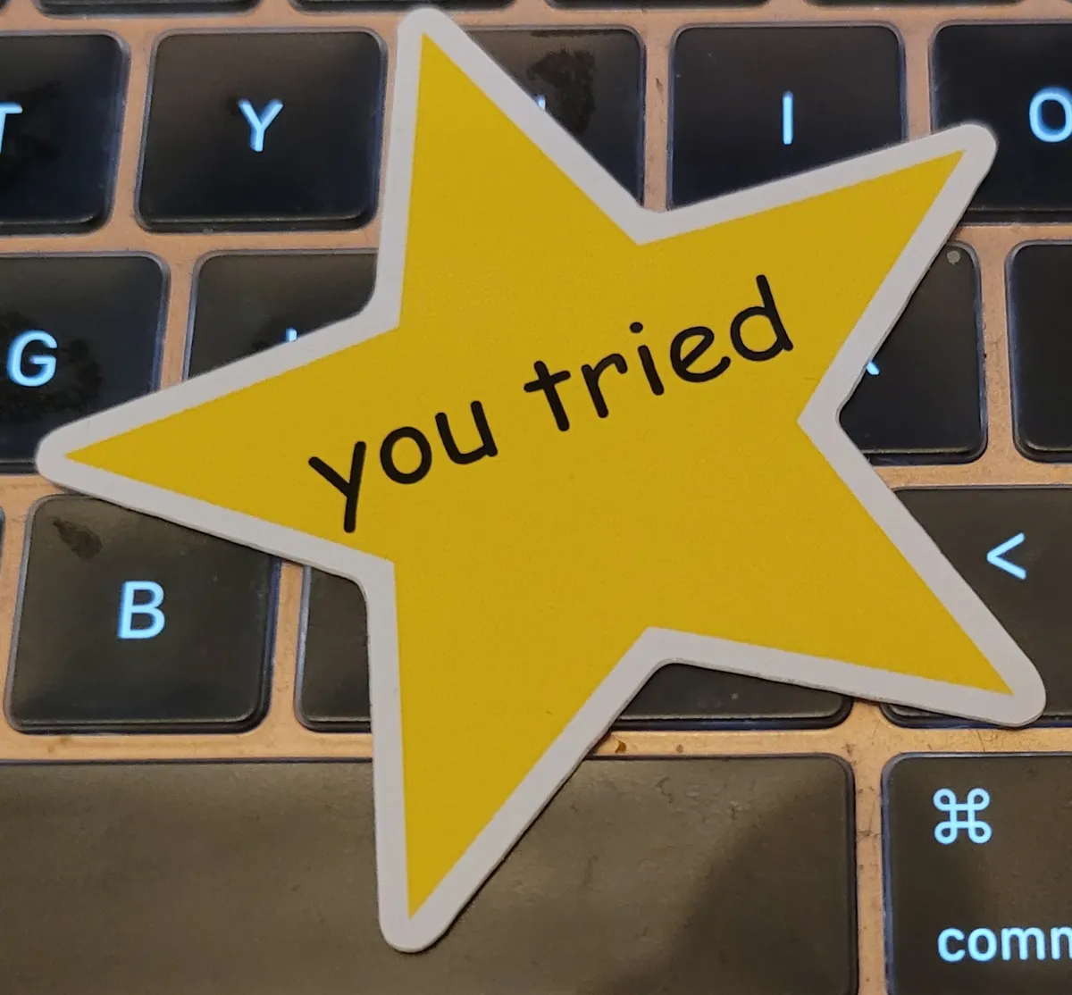 A yellow star with "You tried" written in the middle in black Comic Sans