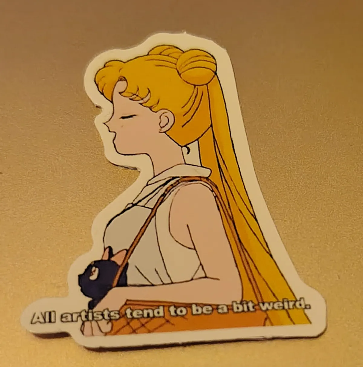 Usagi from Sailor Moon is in profile, with Luna peeking out from her bag. Usagi looks very smug and the text underneath reads 