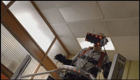 jAnimated GIF from Community, where the Dean is discovering how virtual reality can work as a computer system while wearing gigantic goggles and is shouting