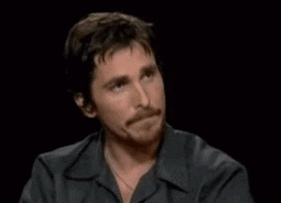 Animated gif of Christian Bale nodding his head while looking to the right. Then Kermit the Frog is nodding his head while looking to the left. They are both in agreement.
