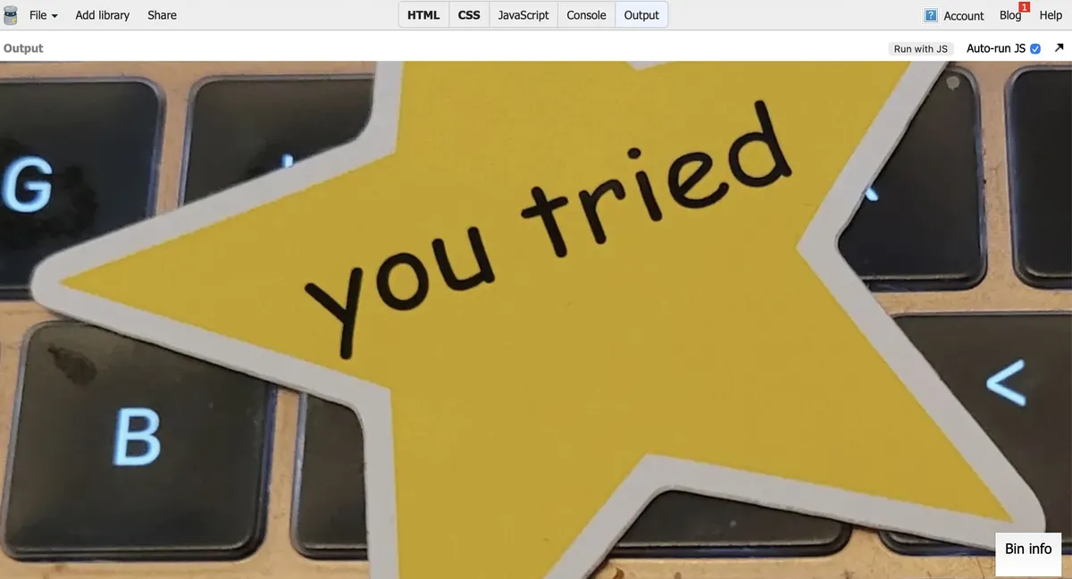 Screenshot of the Output from JSBin, showing a You Tried yellow star sticker sitting on a keyboard, the image taking up the entire window.