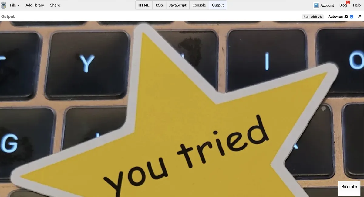 Screenshot of the Output from JSBin, showing the same You Tried yellow star sticker sitting on a keyboard, but this time the image is slightly lowered, showing the top of the star.