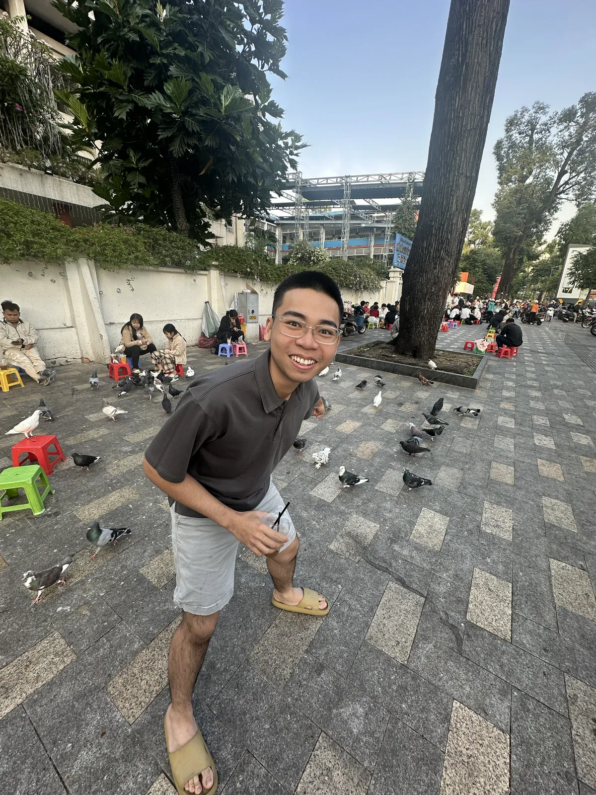 Me in front of a lot of pigeons