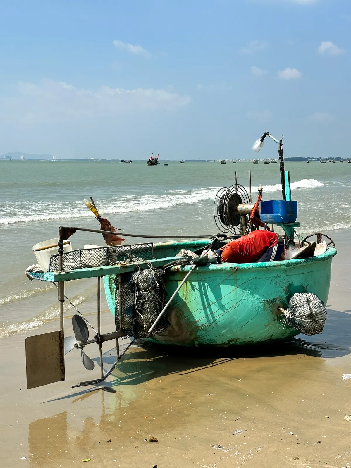 A floating device close to a small boat used by Vietnamese fishers