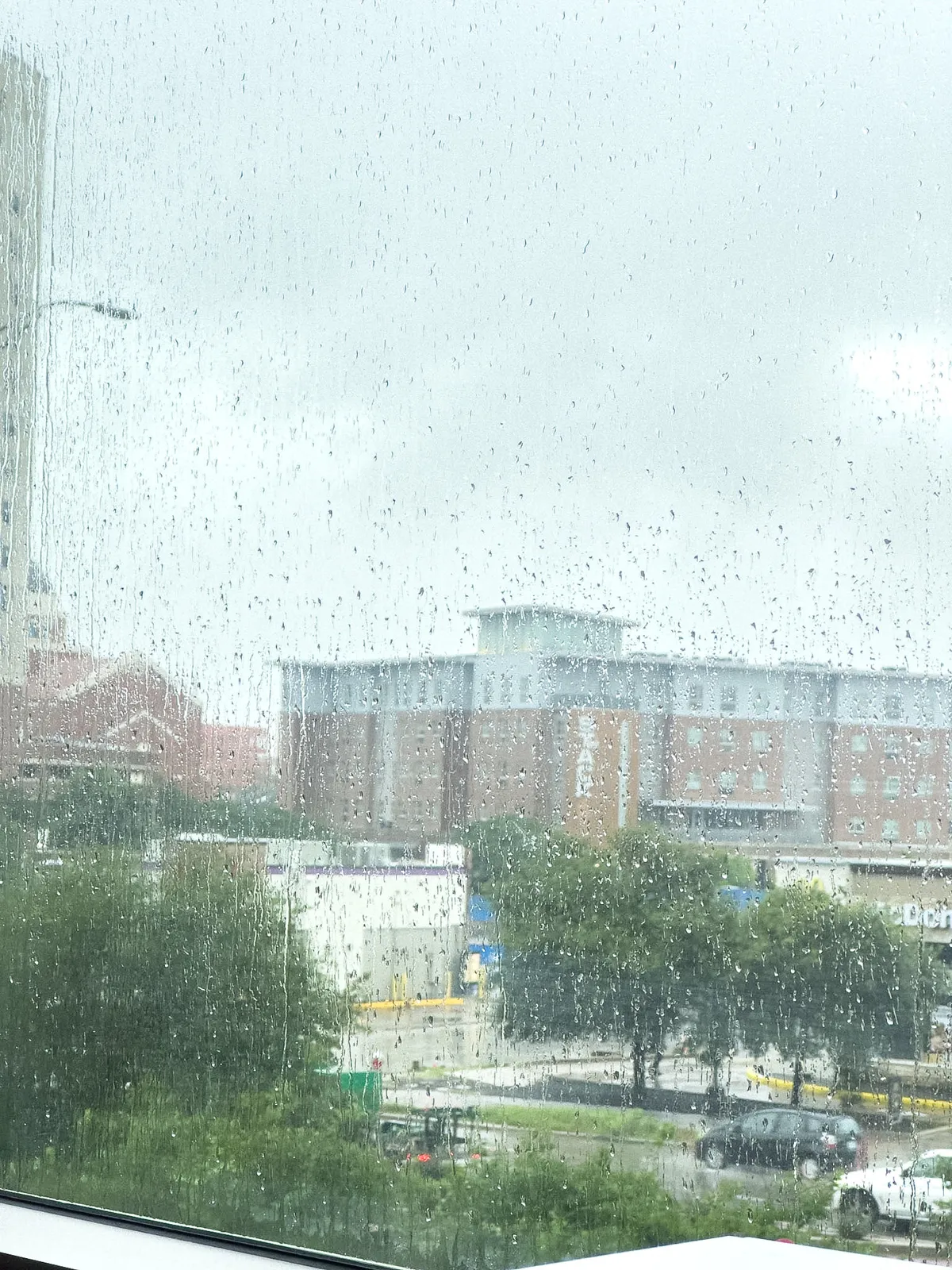 A view from the window with rain drops on it