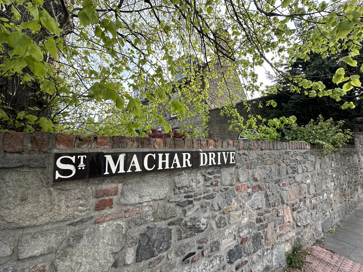 St Machar street sign on some old Scottish granite wall