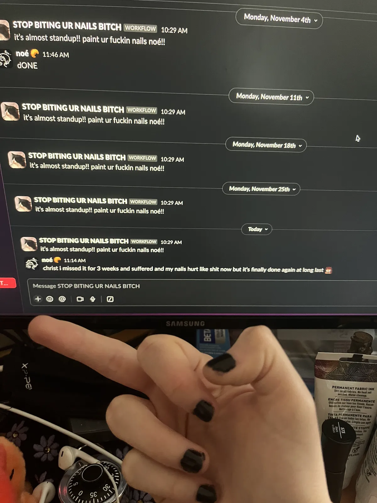 Picture of Noé with short painted nails giving the middle finger to her workflow bot that's gone 3 weeks with no response saying that she did it.