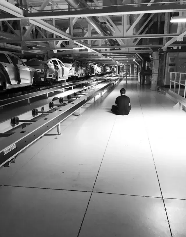 elon-musk-sitting-on-the-factory-floor