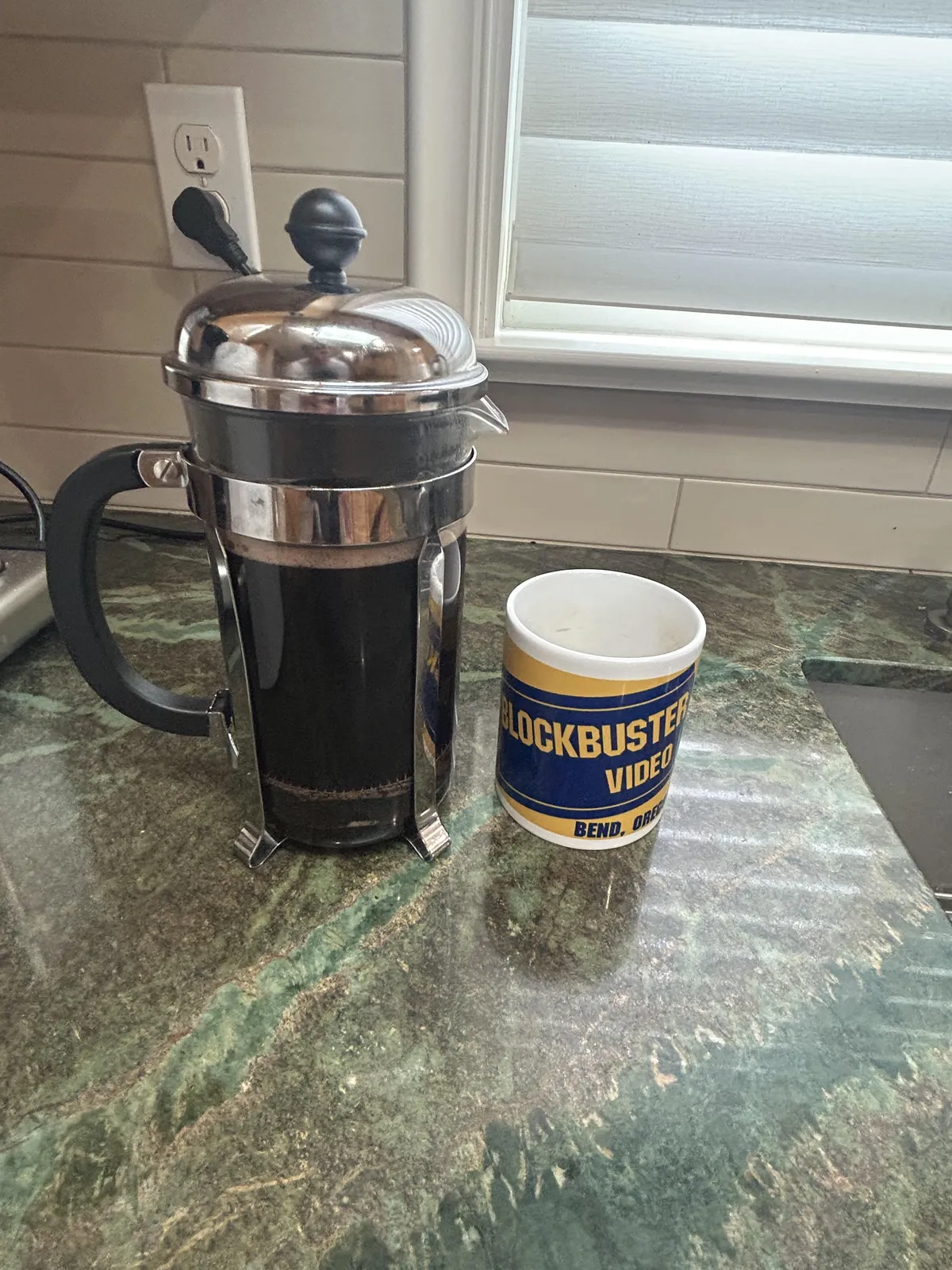 French press and coffee mug