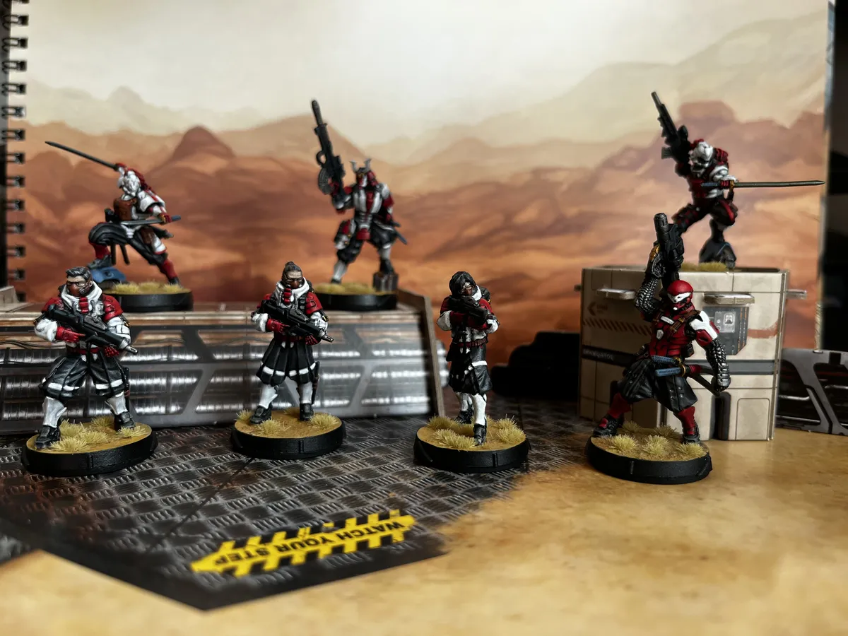 A bunch of JSA minis I painted up for my first game of Infinity