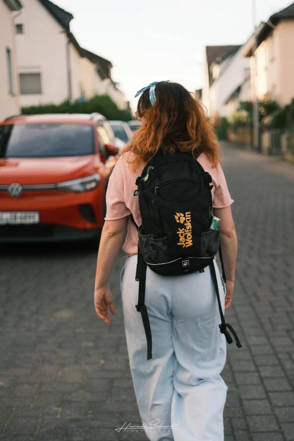 Women walking through the village during an evening walk.