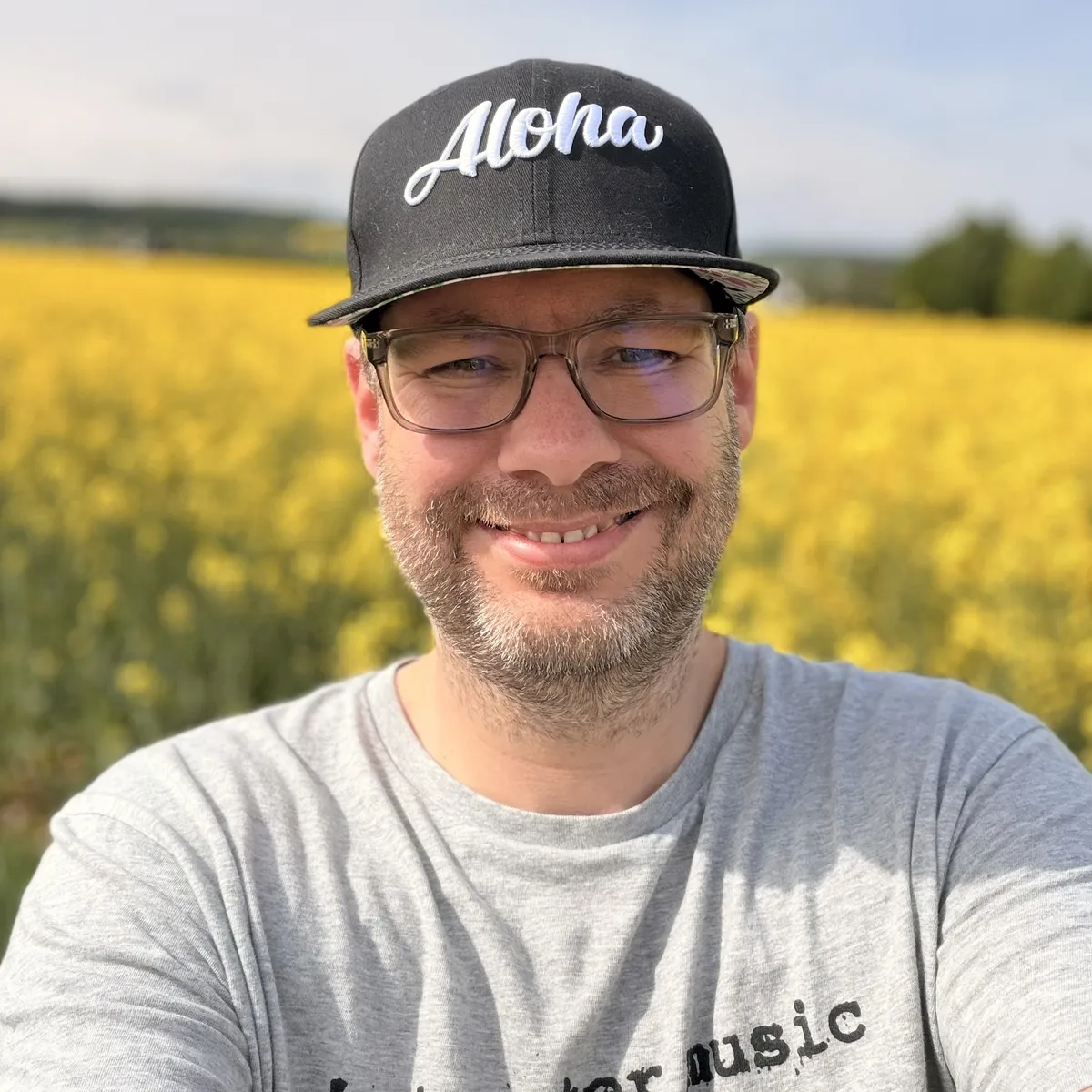 Selfie of a man smiling, wearing an 