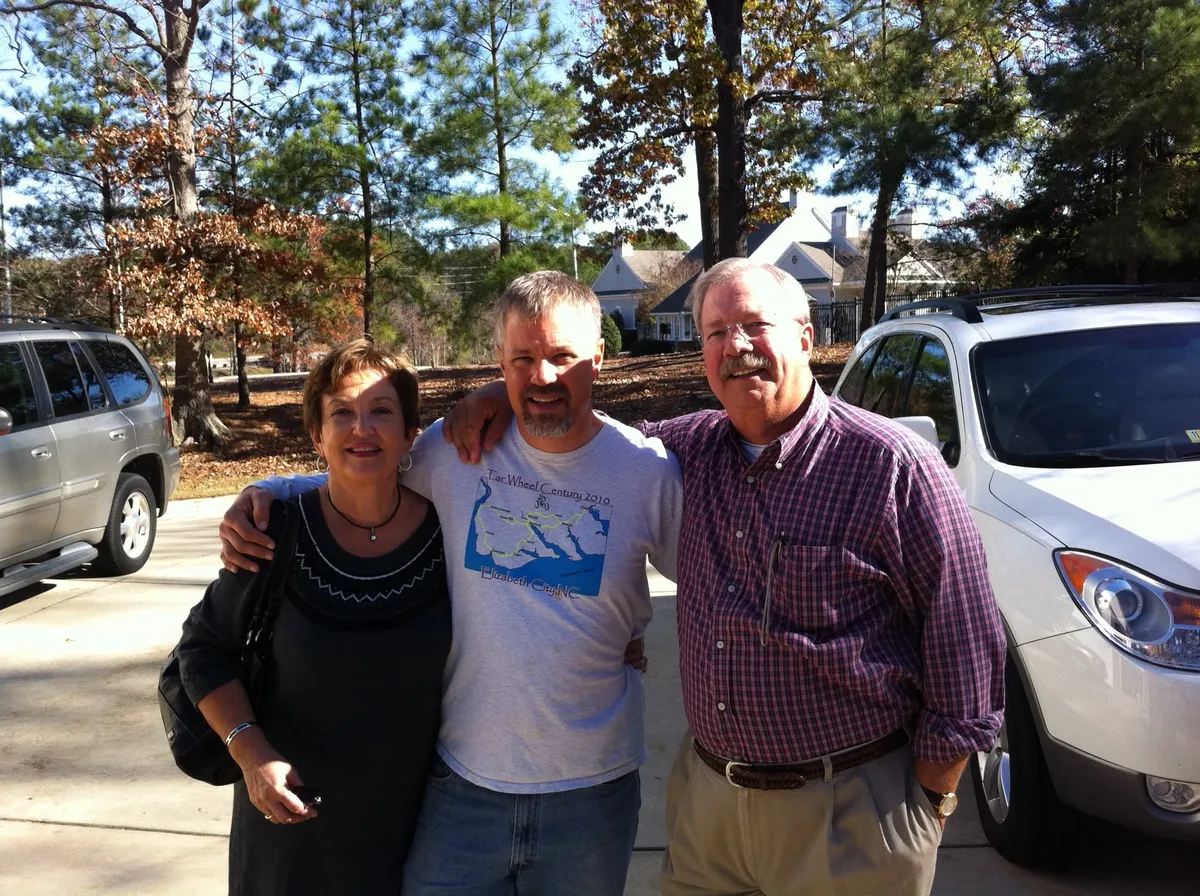 Middle aged man with his prents