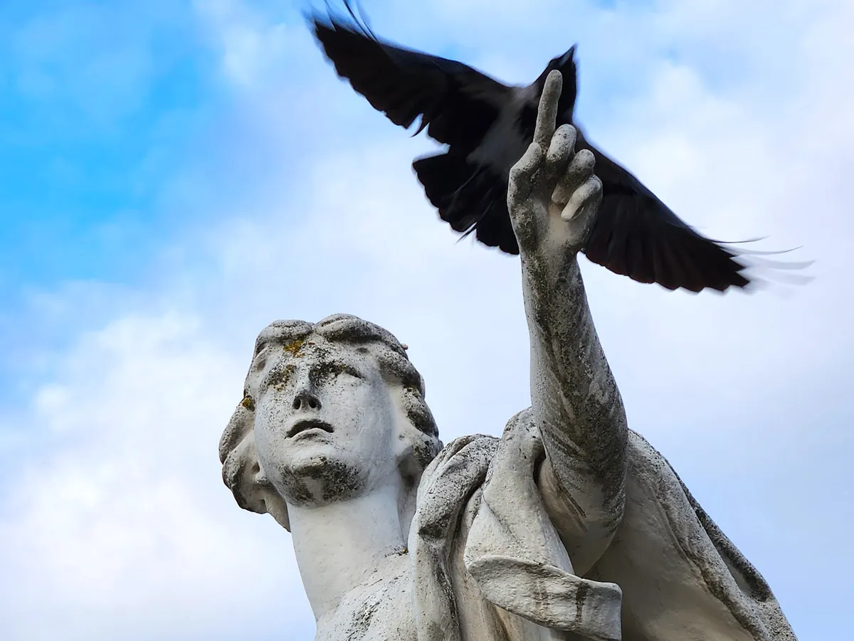 prague bird statue loganletsgo