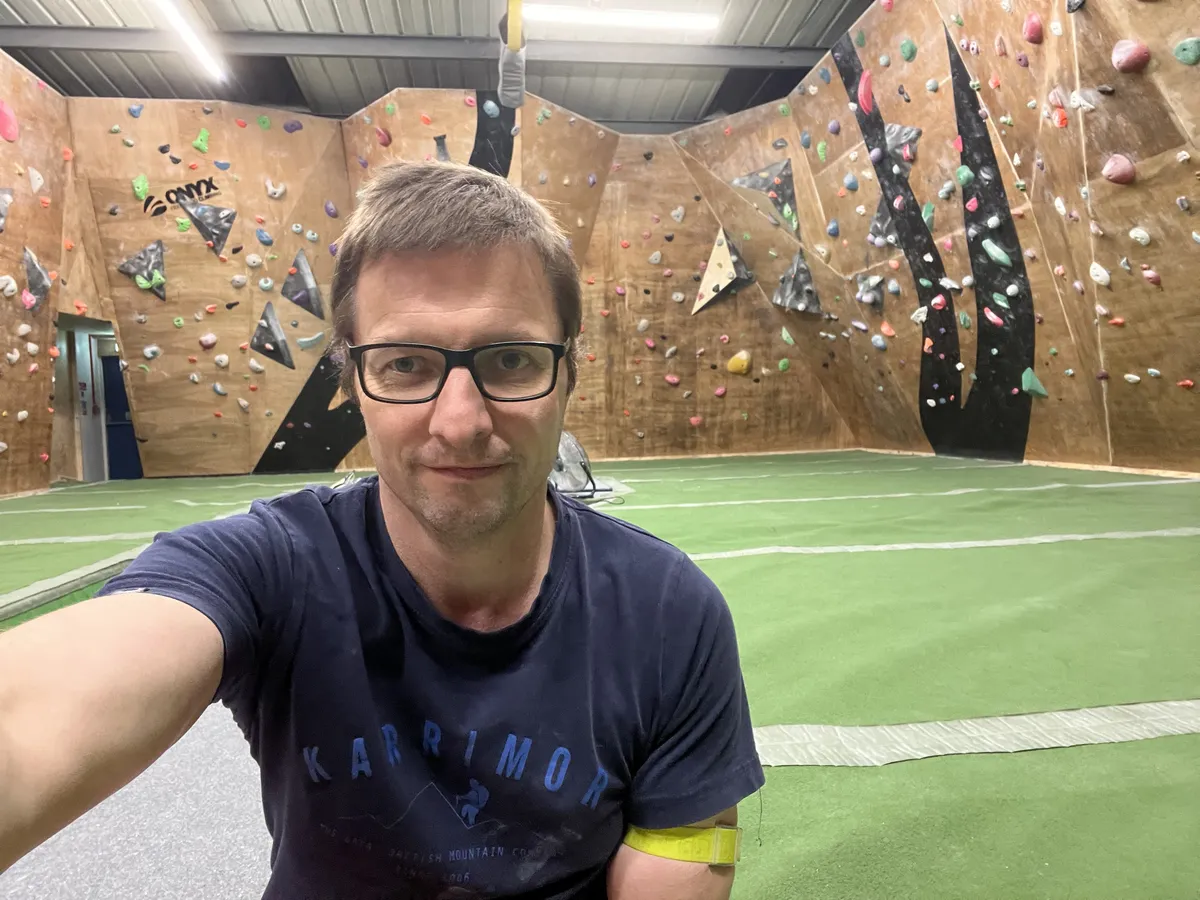 Picture of me sat in the backroom at Onyx between climbs, in desperate need of a haircut