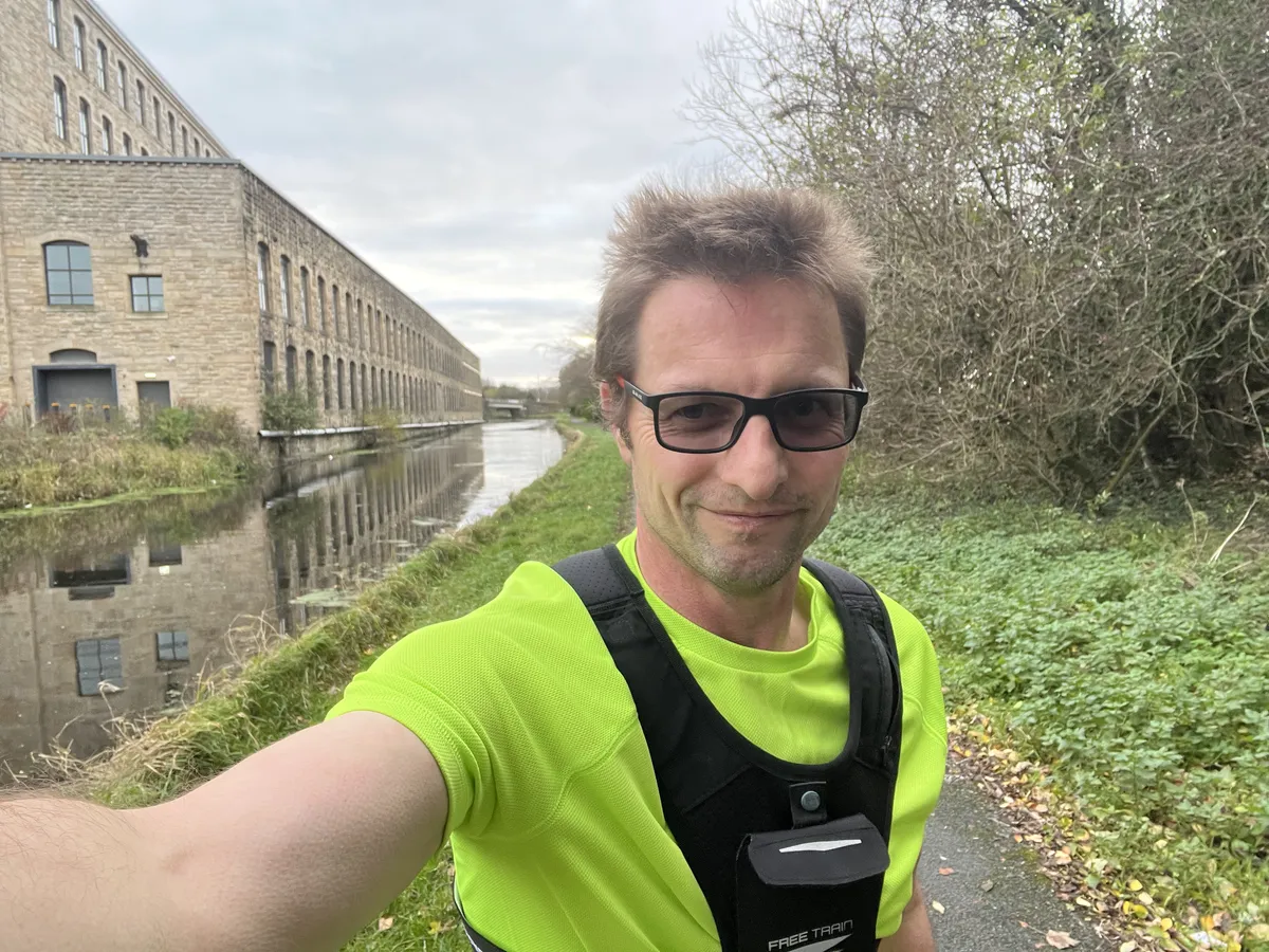 Me mid-run with incredibly bad hair, and the much more impressive Northlight Mill and Leeds-Liverpool canal beyond