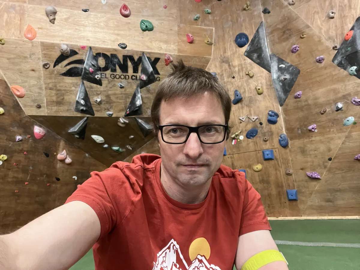 A sharp corner overhang on a plywood based bouldering wall