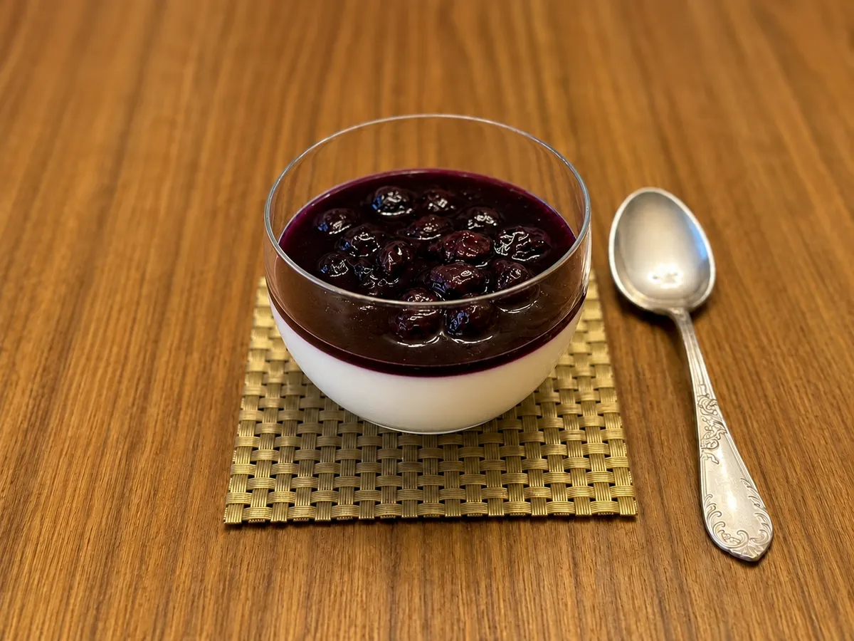 Vanilla panna cotta with blueberry reduction