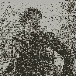 A portrait of a man with glasses with a 1-bit dither filter applied
