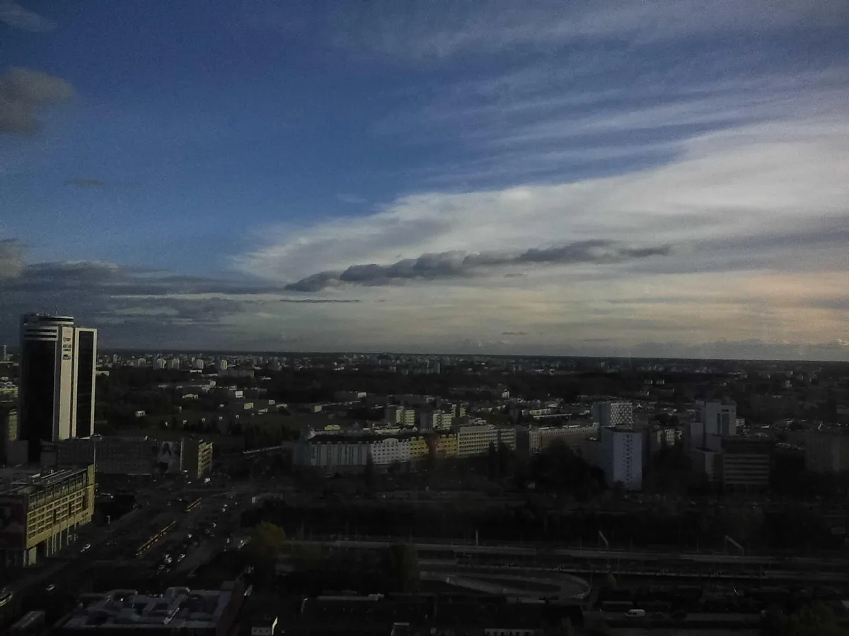 view from my twenty-something floor office window, rather dark on the buildings, but the sky was a very nice shade of blue mixed with white clouds, painting-esque
