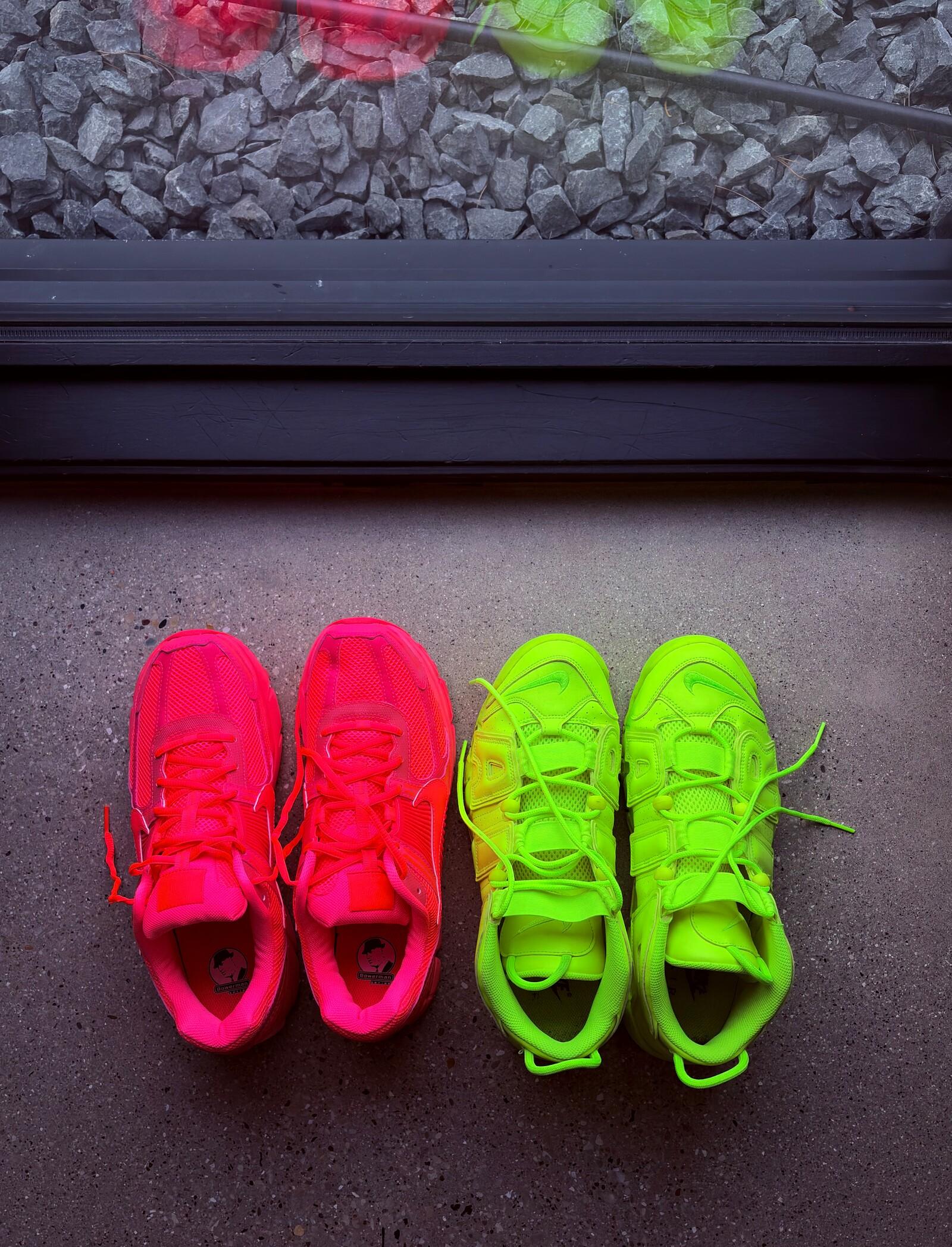 neon pink and volt green sneakers side by side