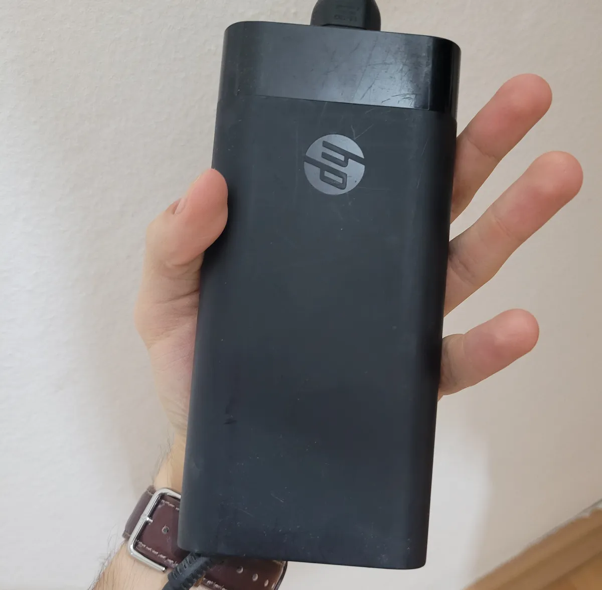 the gargantuan 200w charger compared to my hand