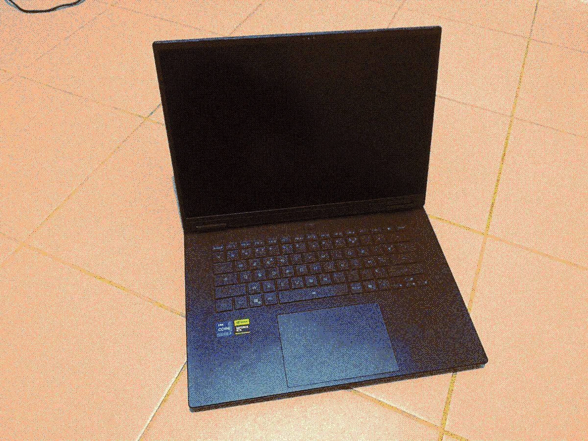 Image of the laptop named IRIS. The laptop is opened on the floor and looks very gaming. That's because it is indeed a gaming laptop.