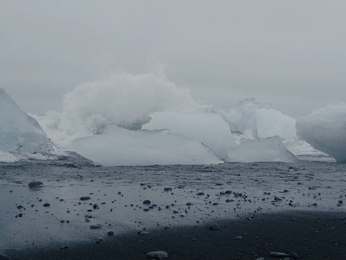 waves crashing into small icebergs