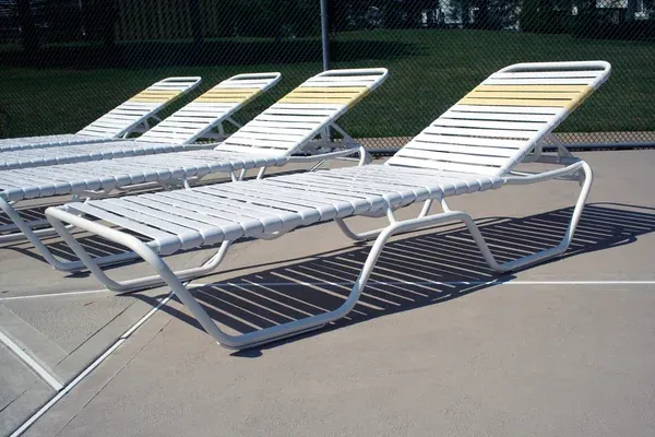 depositphotos_2119847-Reclining-chairs-at-the-pool