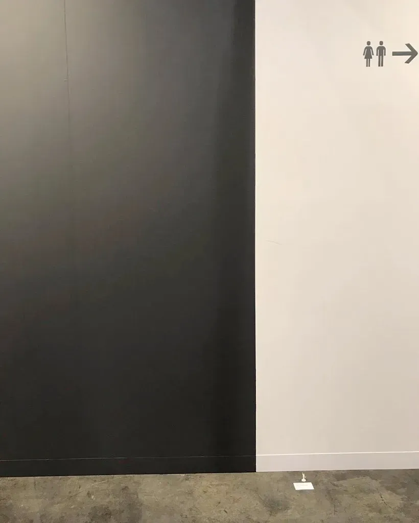 Photo of a small figure holding up a flag in one hand and an umbrella in the other, placed on a surface next to a bathroom, with a sign that says 'Lady Liberty Hong Kong, There's No Art Without Freedom' next to it. Source: Telegram, Jun 2020 image