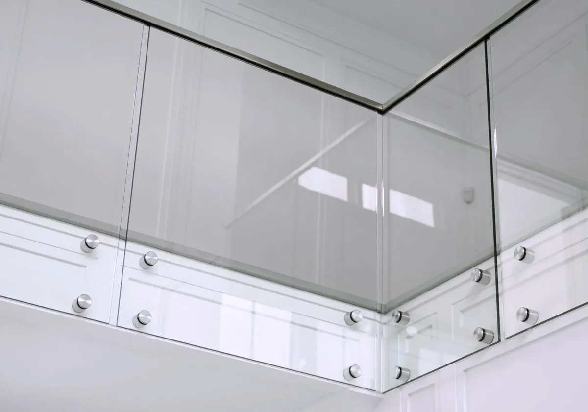 A glass railing held by the floor using standoffs