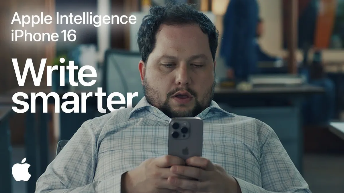 A screenshot showing a person looking at their iPhone from one of the Apple Intelligence ads.