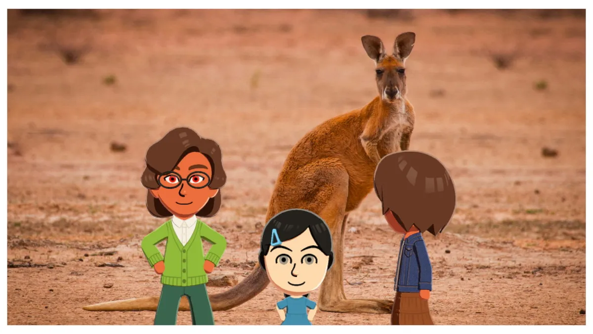 Nanako, Chance, and Phiphi take a photo with a kangaroo.