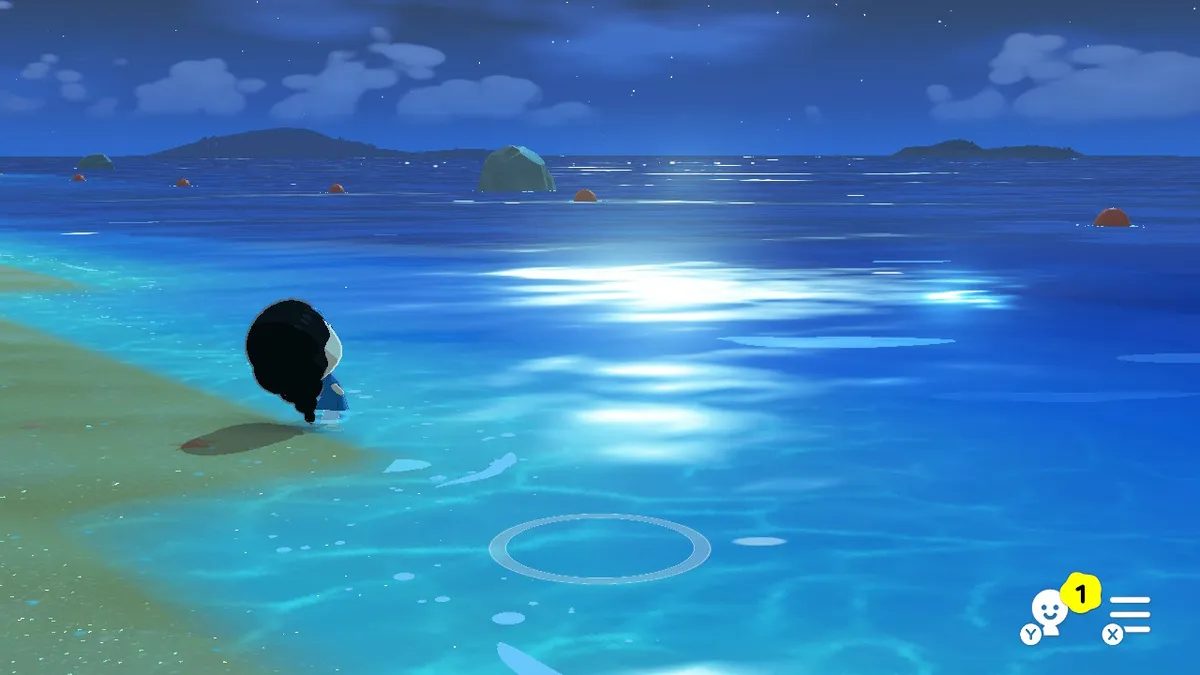 Nanako by the seashore, looking out at the waves.