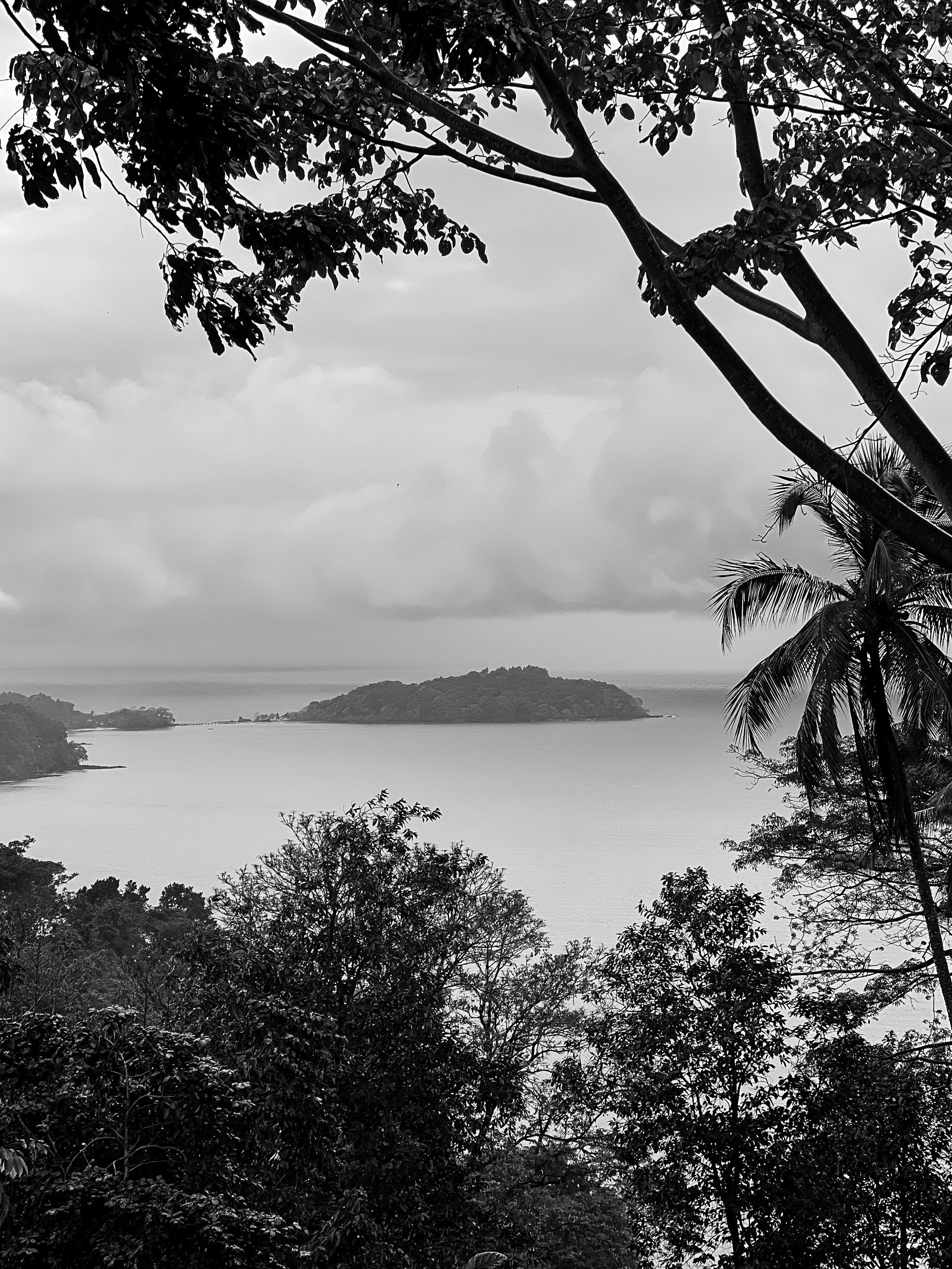 An islet is seen in the distance.