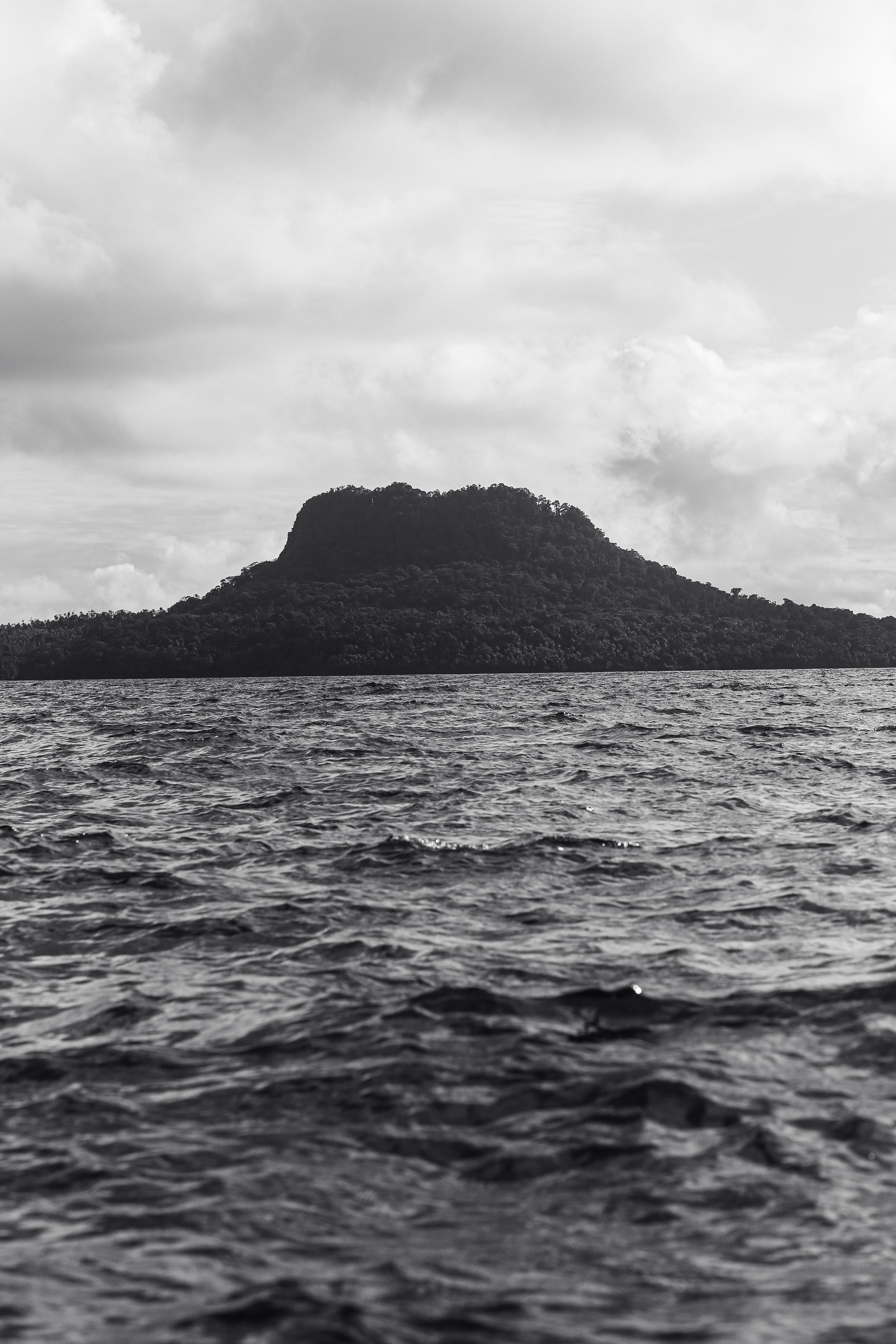 A mountain rises from the sea.
