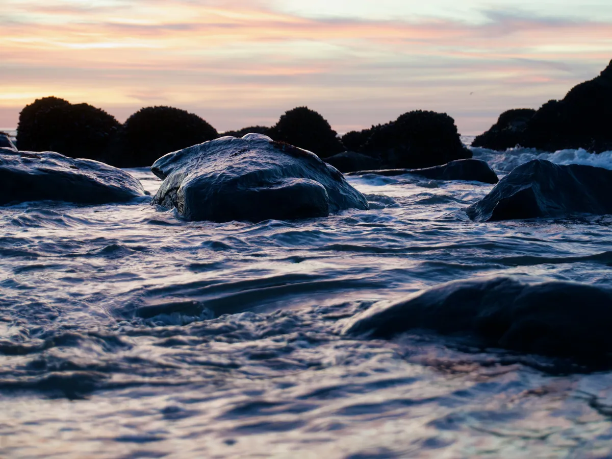Rock and water cast in light