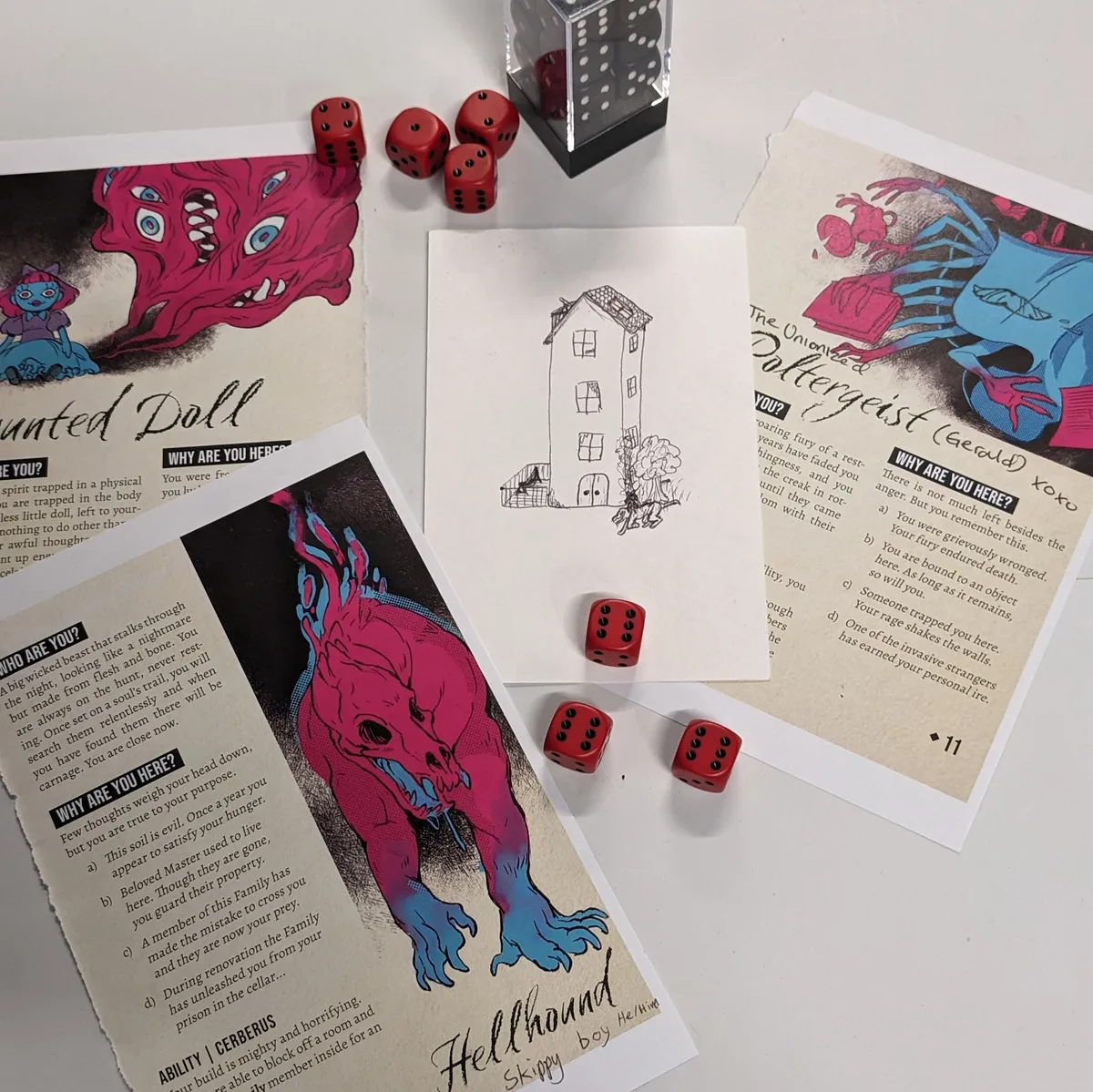 three character sheets (hellhound, haunted doll, poltergeist) around a tower house and some dice