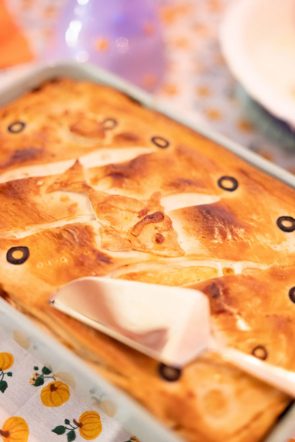A closeup of the pie decorated with fish made out of dough.