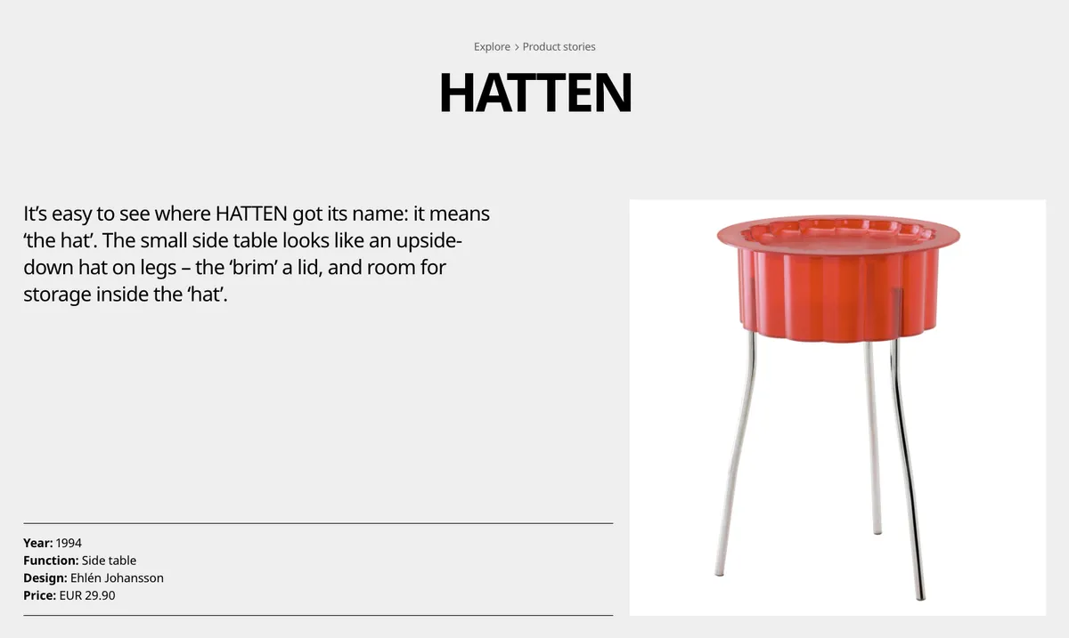 A red, round side table with metal legs and a translucent top. The table part has scalloped ridges.