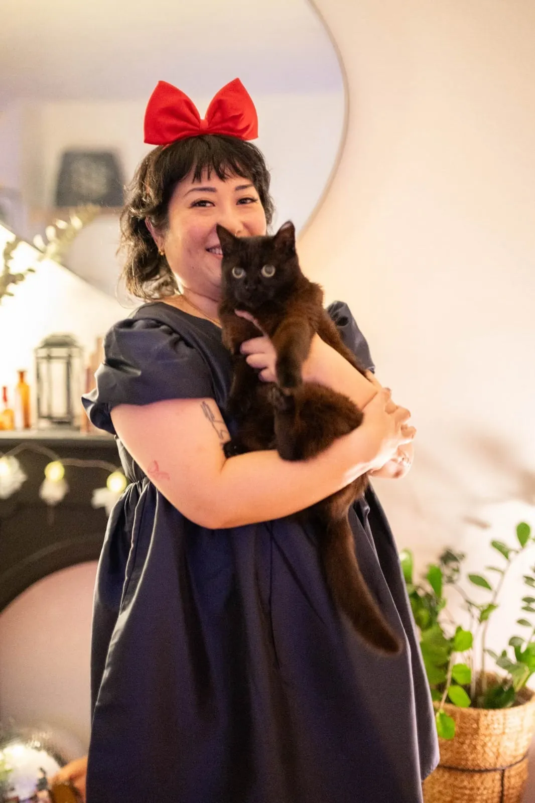 Peige smiling and looking at the camera, with Boba looking apprehensively at the camera.