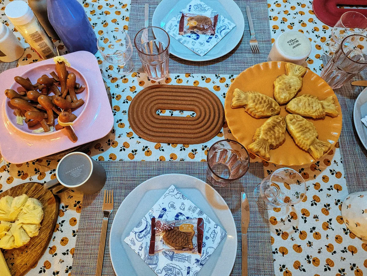 Tabletop view of the fish-themed spread of dishes.