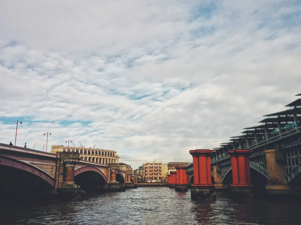Another view of some bridges facing each other across the river.
