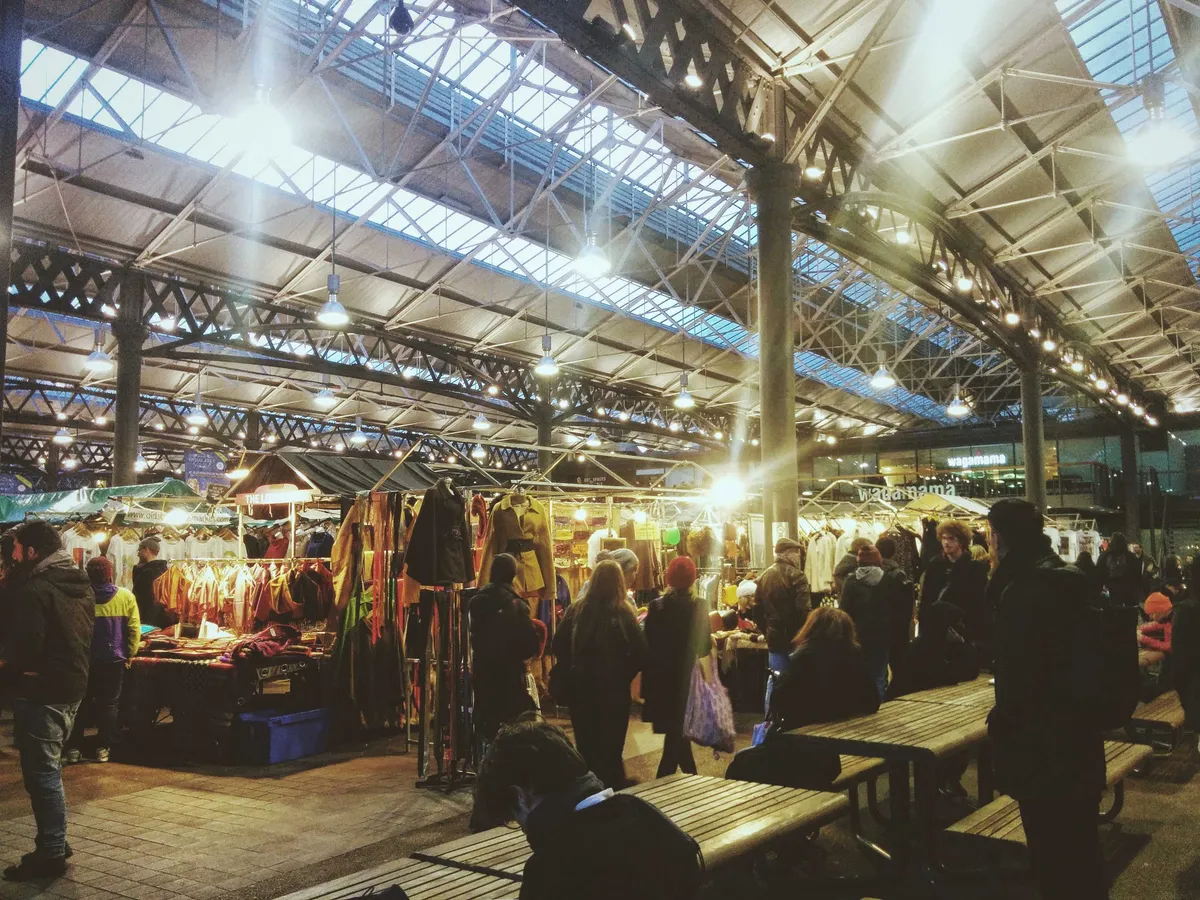 Old Spitalfields Market. It is filled with people and stalls.